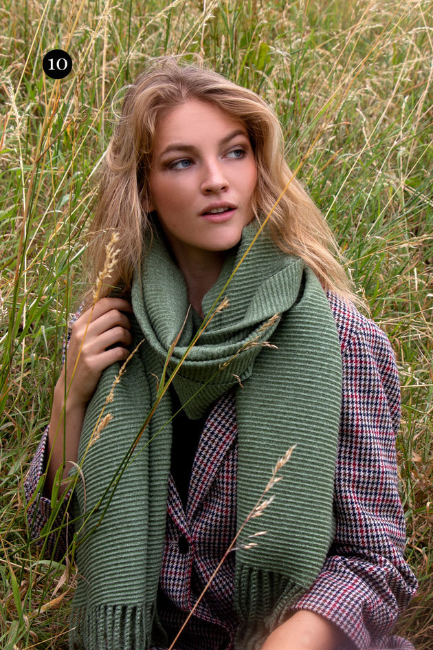 woman wearing cosy scarf in sage sage