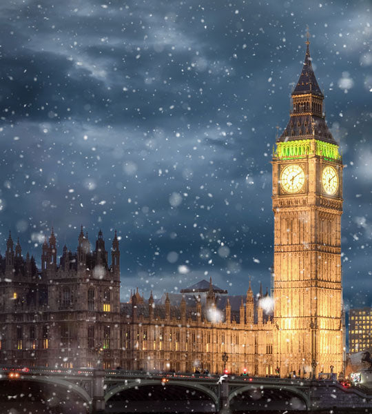 Winter Sale Graphic - Big Ben tower illuminated at night with snow falling in London