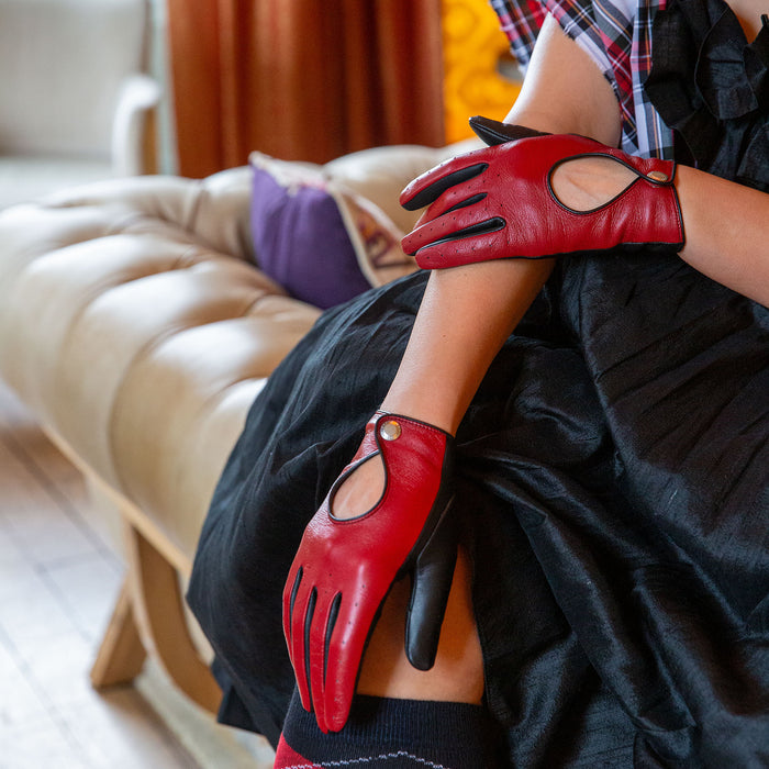 Woman wearing Berry Black leather touchscreen driving gloves 